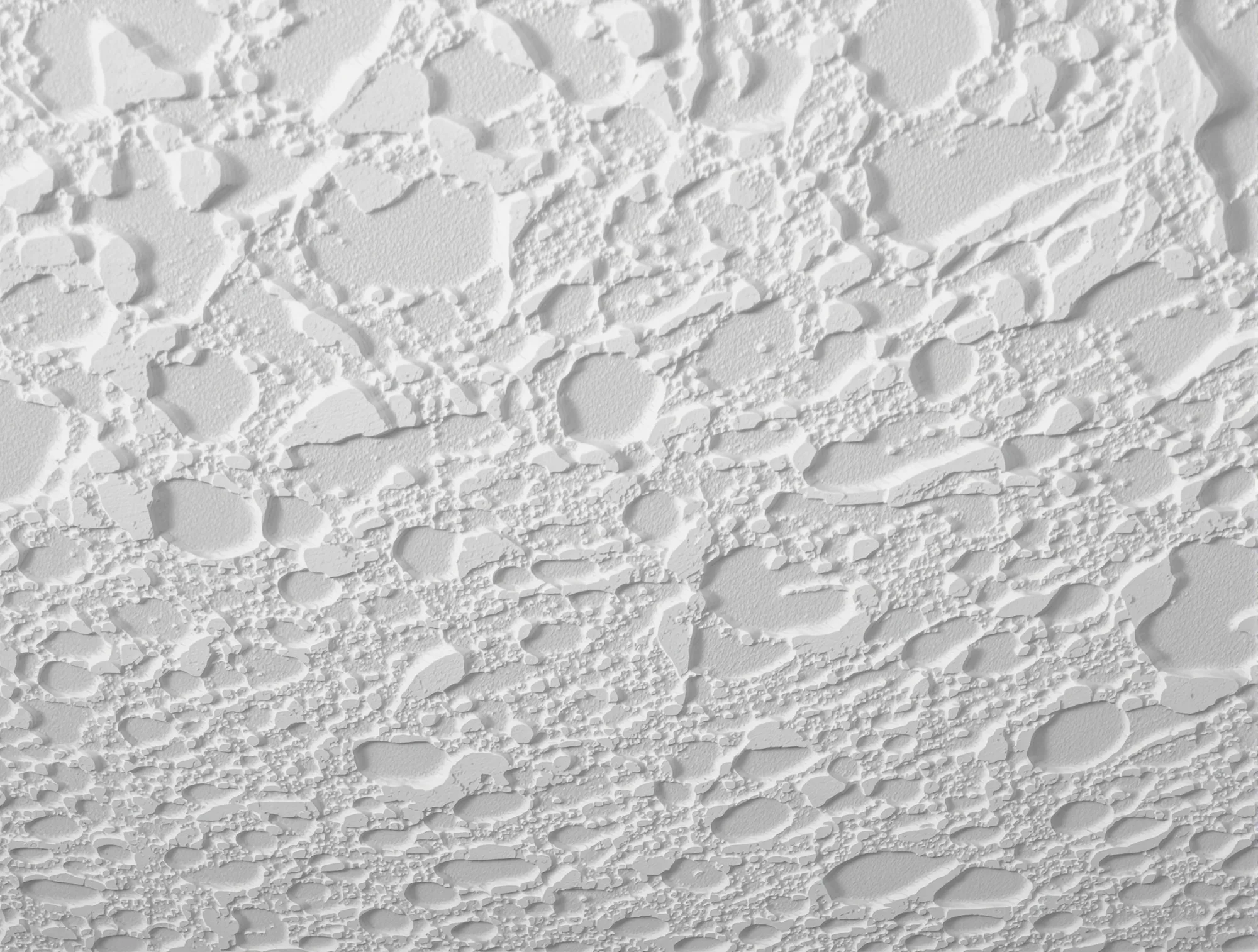 Close-up of knockdown texture with flattened islands of compound in side light